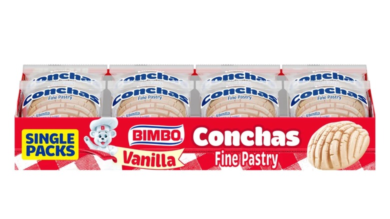 Una caja roja abierta con la parte superior de conchas Bimbo.